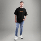 Front view of a black oversized t-shirt with a small Ford Mustang logo and classic car graphic on the chest – styled with casual jeans.