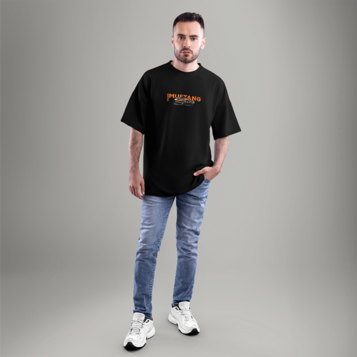 mustang-front Front view of a black oversized t-shirt with a small Ford Mustang logo and classic car graphic on the chest – styled with casual jeans.