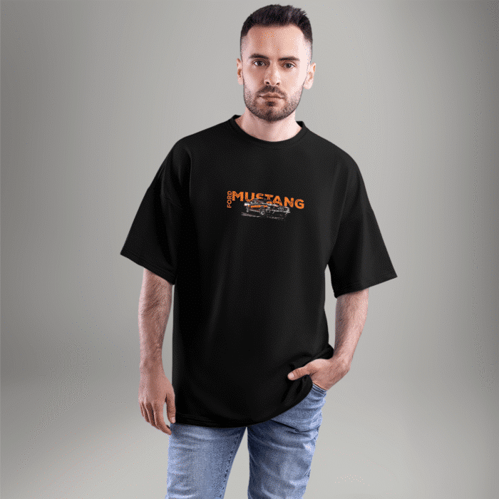 mustang-front-closeup Front view of a black oversized t-shirt with a small Ford Mustang logo and classic car graphic on the chest – styled with casual jeans.