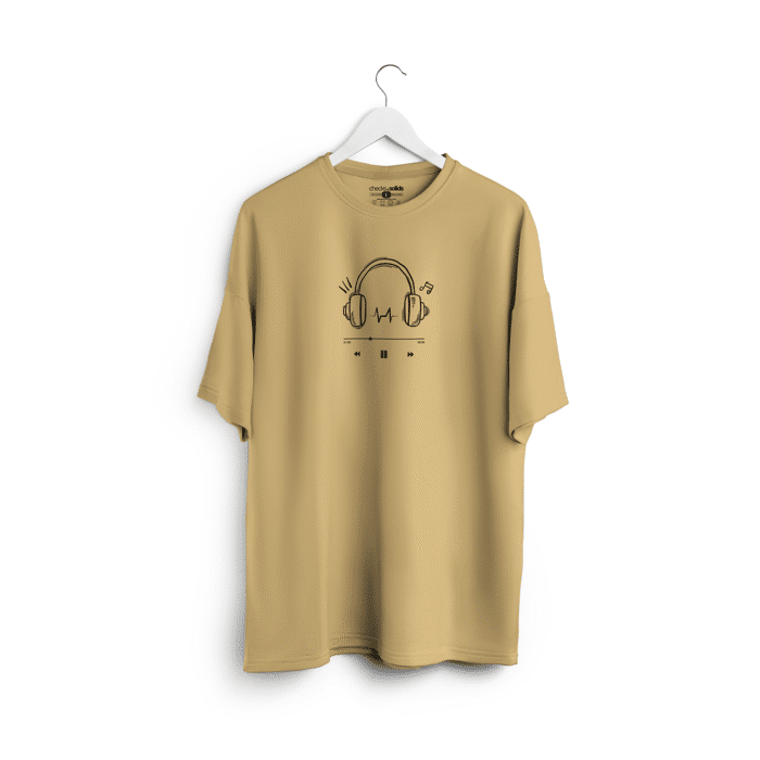 beige-music-tee Beige unisex oversized t-shirt featuring a black headphone line art with music notes and play controls, designed by Checks & Solids for casual, music-inspired fashion.